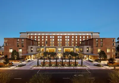 a building with a parking lot in front of it at Luskin Hotel in Los Angeles