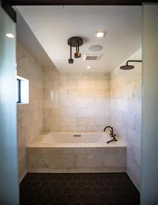 a large bath tub in a bathroom with a sink at Haven Coliving in Los Angeles