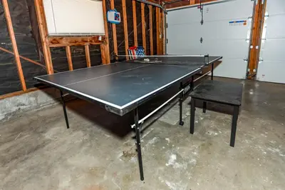 a ping pong table in a room with a ping pong ball at Bohemia Big Bear-1926 by Big Bear Vacations in Big Bear Lake