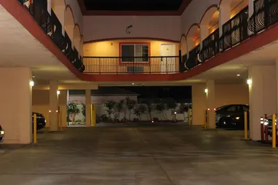 an empty parking lot in a large building at ERTH INN by AGA Maywood in Maywood