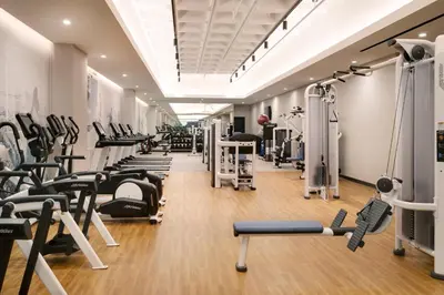 a gym with rows of treadmills and machines at Hyatt House LAX Century Blvd in Los Angeles