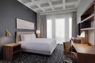 a hotel room with a white bed and a window at Hyatt Place LAX/Century BLVD in Los Angeles