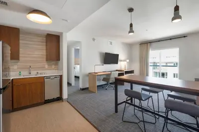 a kitchen and dining room with a table and chairs at Residence Inn by Marriott Marina del Rey in Los Angeles