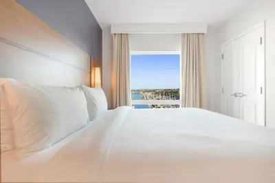 a bedroom with a white bed and a window at Residence Inn by Marriott Marina del Rey in Los Angeles