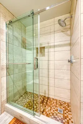 a shower with a glass door in a bathroom at Hotel Lexen Newhall & Santa Clarita - Near Six Flags Magic Mountain in Santa Clarita
