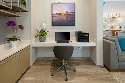 an office with a desk with a laptop and a printer at Staybridge Suites - Long Beach Airport by IHG in Long Beach