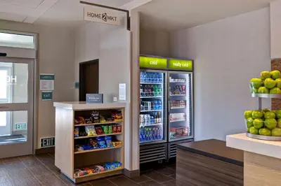 a store with two refrigerators in a grocery store at Home2 Suites By Hilton Barstow, Ca in Barstow