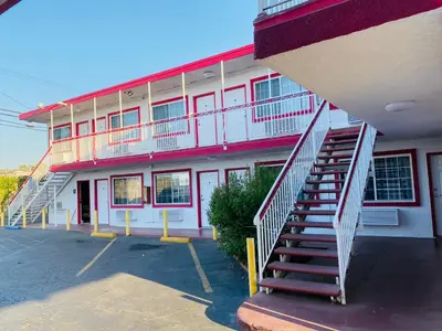 a building with a staircase in front of it at Casa Valentine Inn - Los Angeles in Los Angeles