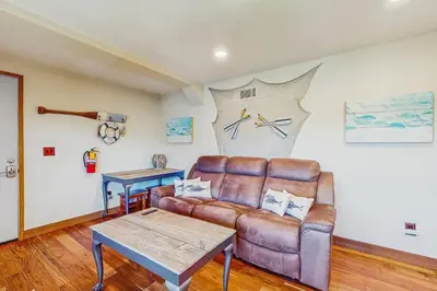 a living room with a couch and a table at Lake View Magic in Crestline