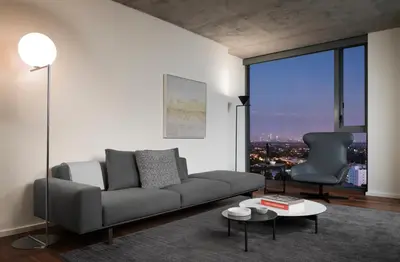 a living room with a couch and a chair at AKA West Hollywood in Los Angeles