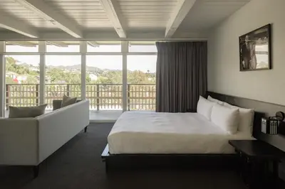 a hotel room with a bed and a large window at Hollywood Hills Hotel in Los Angeles