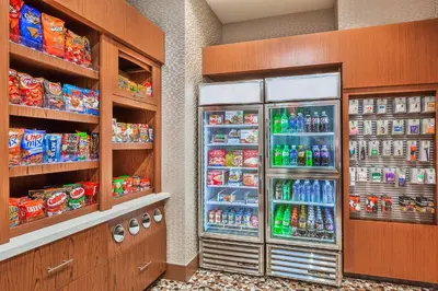 a convenience store with a refrigerator filled with drinks at Springhill Suites by Marriott Anaheim Maingate in Anaheim