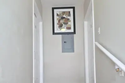 a hallway with a framed picture on the wall at Los Angeles Retreat Close to Hotspots in Los Angeles