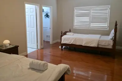 a bedroom with two beds and a wooden floor at Los Angeles Retreat Close to Hotspots in Los Angeles