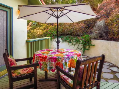 a table with an umbrella on a patio at Topanga Canyon Inn Bed and Breakfast in Topanga