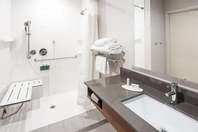 a bathroom with a sink and a shower at Fairfield by Marriott Inn & Suites Anaheim Los Alamitos in Los Alamitos
