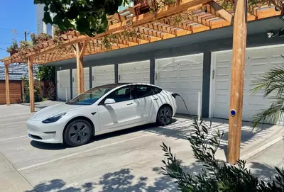 a white car parked in front of a house at Hollywood’s Suite in Los Angeles