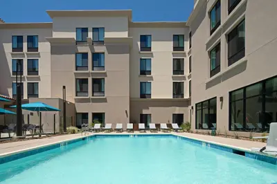 a large swimming pool in front of a building at SpringHill Suites by Marriott Valencia in Valencia