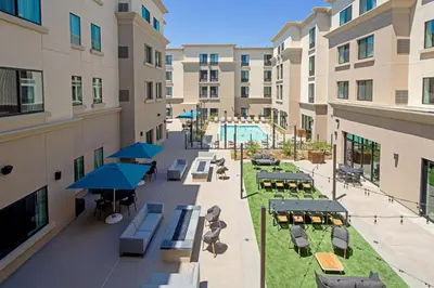 an overhead view of a hotel courtyard with tables and chairs at Residence Inn by Marriott Valencia in Valencia