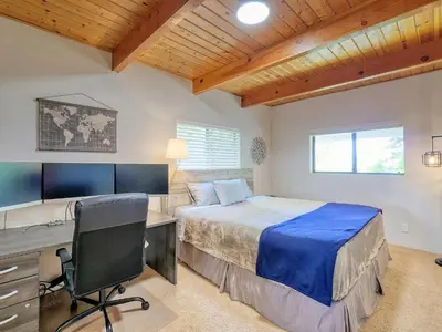 a bedroom with a bed and a desk and a computer at Kid's Paradise! Ball Pit 2 Lofts Lakeview 5 bd, 3ba in Lake Arrowhead