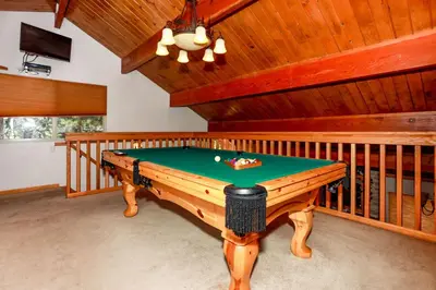 a pool table in a room in a house at Mountain Adventure - 1931 by Big Bear Vacations in Big Bear Lake