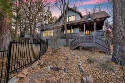 a house with a fence in front of it at Splash Mountain - 1904 by Big Bear Vacations in Big Bear Lake