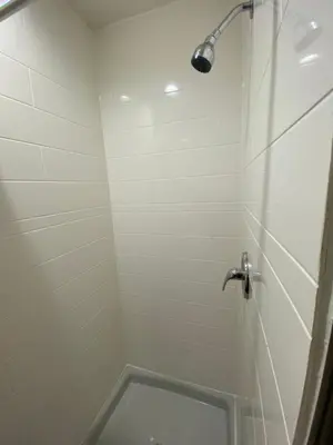 a bathroom with a shower with a toilet at Sandman Motel in Los Angeles