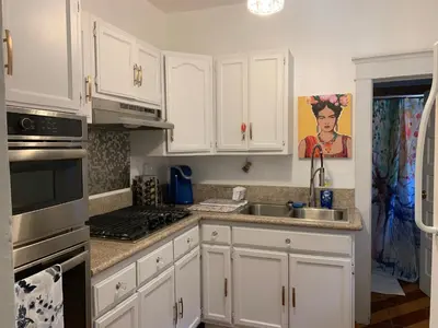 a kitchen with white cabinets and a sink at Private 1BR Apt LA Home Sweet Home in KTown\u5bb6 in Los Angeles