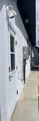 a white door on a white building with a window at Private 1BR Apt LA Home Sweet Home in KTown\u5bb6 in Los Angeles