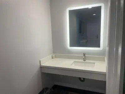 a bathroom with a sink and a mirror at La Palma Motel, South Gate - Los Angeles area in South Gate