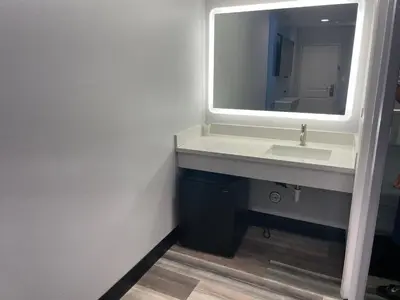 a bathroom with a sink and a mirror at La Palma Motel, South Gate - Los Angeles area in South Gate