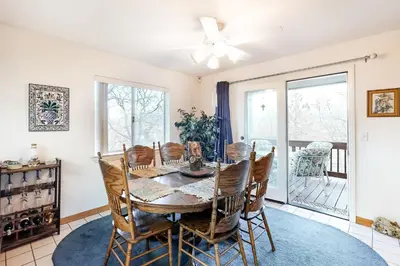 a dining room with a table and chairs at The House Of Light and Sky in Lake Arrowhead