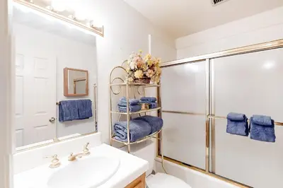 a bathroom with a sink and a shower at The House Of Light and Sky in Lake Arrowhead