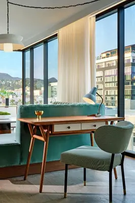 a room with a pool table and a chair at The Hollywood Grande, Autograph Collection in Los Angeles