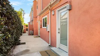 an alley with a door to a building at Art Deco by AvantStay in Los Angeles