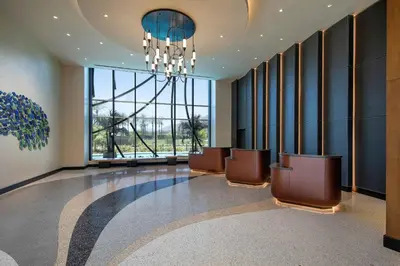 a waiting room with chairs and a large window at Le Meridien Pasadena Arcadia in Arcadia