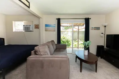 a living room with a couch and a table at Heartwell Park Beauty Long Beach in Long Beach