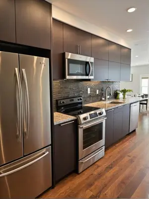 a kitchen with stainless steel appliances and wooden cabinets at Modern Luxury Apartments in the Heart of Los Angeles in Los Angeles