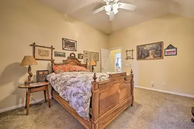a bedroom with a bed and a ceiling fan at Wraparound Deck Woodland Cabin in Lake Arrowhead in Lake Arrowhead