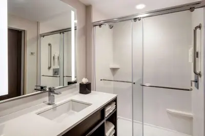 a bathroom with a sink and a shower at Hilton Garden Inn Chino Hills Pomona CA in Pomona