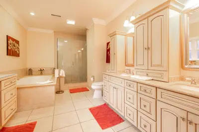 a bathroom with a tub and a toilet and a sink at The Grand Chalet #1989 by Big Bear Vacations in Big Bear Lake