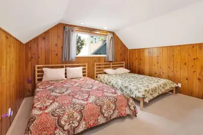 a bedroom with two beds and a window at Conklin Paradise #1993 by Big Bear Vacations in Big Bear Lake
