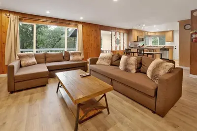 a living room with a couch and a coffee table at Conklin Paradise #1993 by Big Bear Vacations in Big Bear Lake