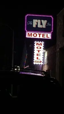 a sign for the tv movie motel on a building at The Fly Inn Motel in Lynwood