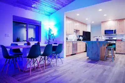 a kitchen with a table and chairs in a room at Pine Mountain Club Villa with Sauna, Deck and Views! in Pine Mountain Club