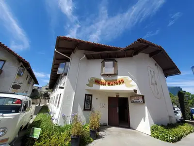 a white building with a sign on it at Hotel Europa in Smeltzer