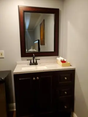 a bathroom with a sink and a mirror at Hotel Europa in Smeltzer