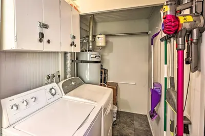 a laundry room with a washer and dryer at Running Springs A-Frame with Deck and Mtn Views! in Running Springs