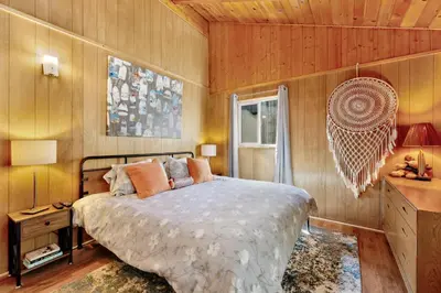 a bedroom with a large bed and a window at Marin Getaway #2013 by Big Bear Vacations in Big Bear Lake
