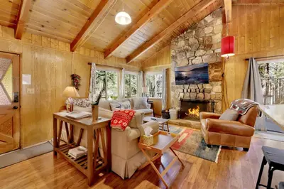 a living room with a couch and a fireplace at Marin Getaway #2013 by Big Bear Vacations in Big Bear Lake